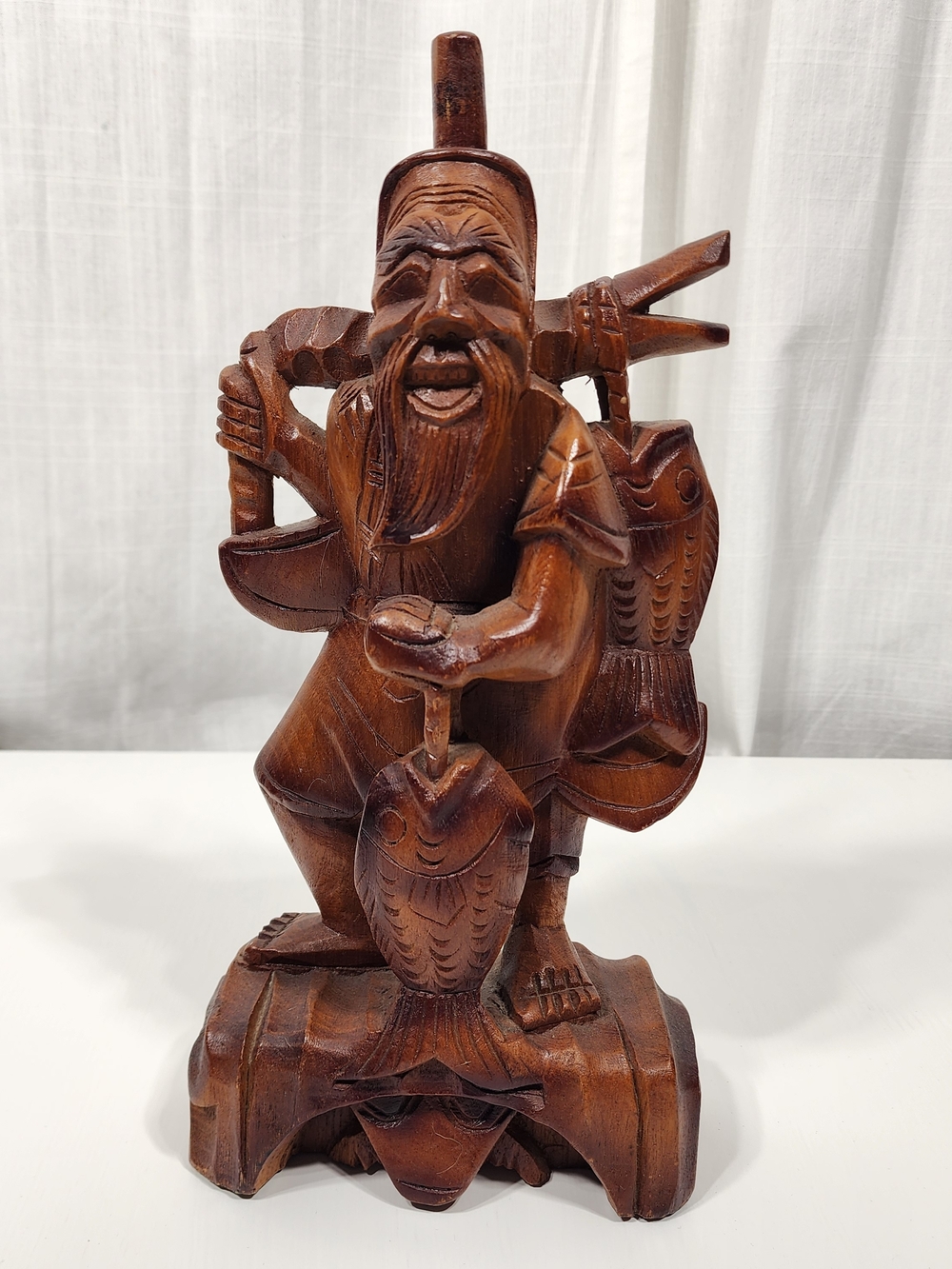 Hand-Carved Wooden Fisherman Sculpture - Brown